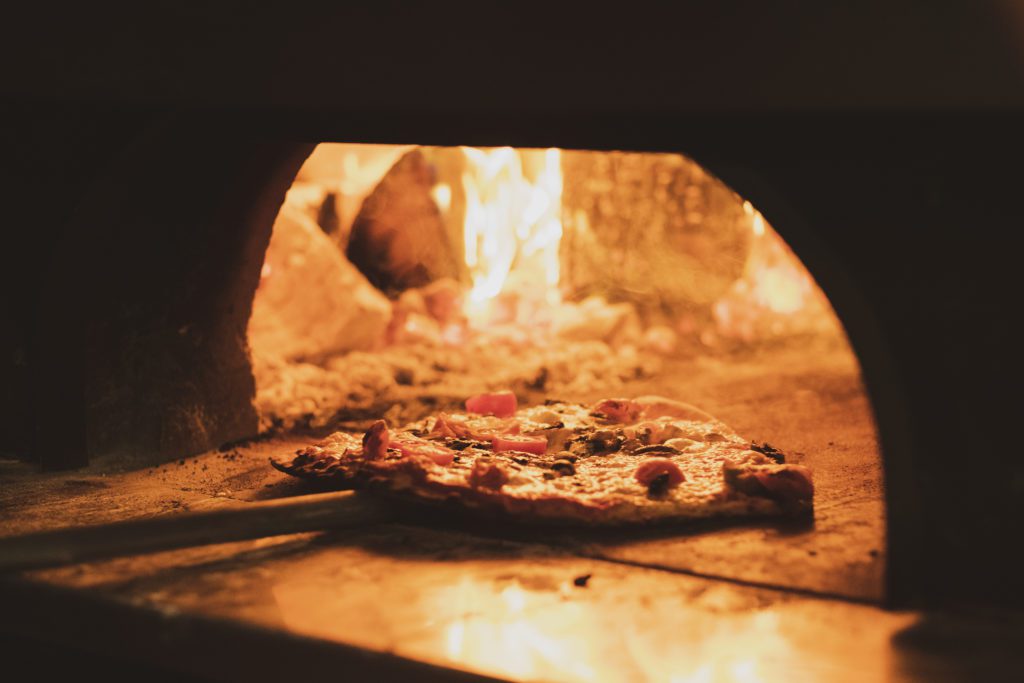 close up of pizza in a wood fired oven in a restau 2021 08 30 00 08 06 utc