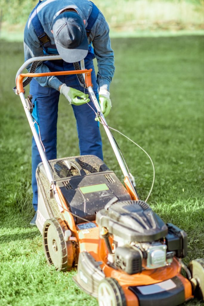 gardener working with lawn mower on the backyard 2021 09 25 03 44 38 utc
