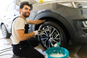 Happy,Young,Mexican,Male,Employee,Washing,A,Vehicle,At,Car