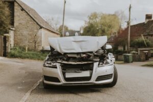 wrecked car parked on the street after a car crash 2023 11 27 04 49 55 utc