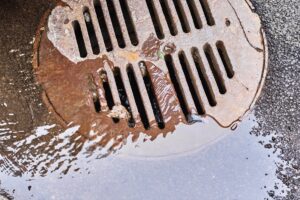 water draining into a sewer manhole after rain on 2025 03 13 01 57 09 utc 1
