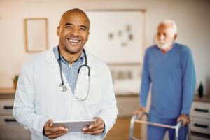 OneMed Solutions happy black doctor using touchpad at nursing home 2024 12 13 21 13 53 utc min 768x512 1
