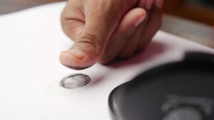 United Protection Agency person hand putting black fingerprints on a paper 2023 11 27 05 32 24 utc 1170x658 1